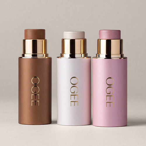 Ogee’s Crystal Contour Collection stands in a row against a neutral background, in rich brown, pearly white, and soft lavender pink finishes.