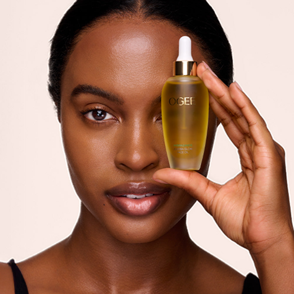 Woman holding Jojoba Oil